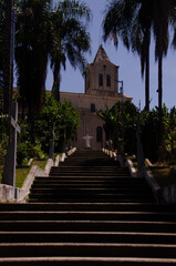Naklejka premium staircase in the santa olimpia neighborhood, in piracicaba, with the Maria Estrela da evangelização Parish in the background