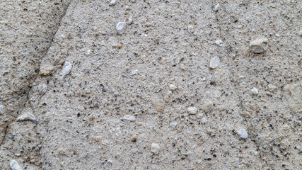 Sandy rock texture with scattered pebbles