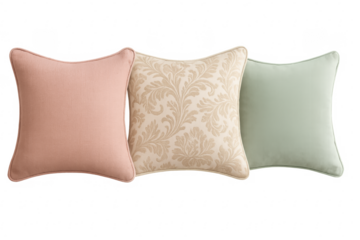 Three decorative cushions in pastel colors on transparent background
