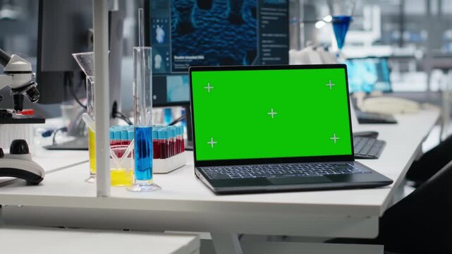 Close up of green screen laptop and computer program displaying DNA data in laboratory. Mockup device and bioinformatics genomics software on PC in modern lab, advancing scientific knowledge