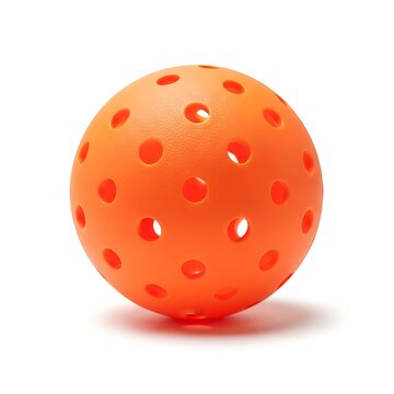 Bright orange floorball with multiple holes isolated on white background, lightweight plastic ball used in floorball sport, close-up studio shot showing texture and perforated design