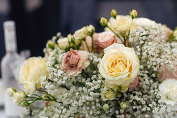 Beautiful bouquet of fresh roses with soft petals and natural leaves, elegant floral arrangement symbolizing love and romance on bright background
