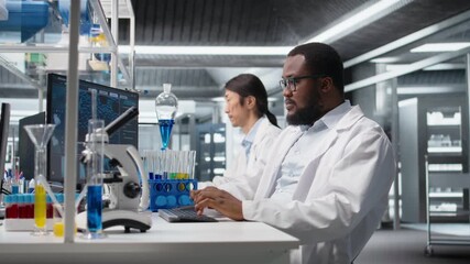 Scientist using computer program for DNA data analysis in laboratory, doing brainstorming. Lab expert thinking, doing research using bioinformatics genomics software on PC, camera A - Powered by Adobe