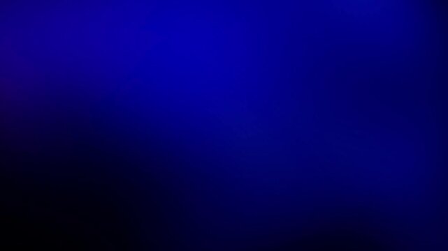 Blue navy background abstract gradient of dark blue. A minimalist and simple loopable backdrop with soft light effects subtly animating across the frame
