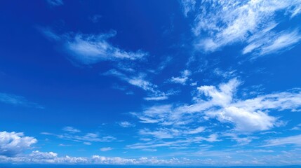 Fototapeta premium Vibrant Blue Sky Panorama with Wispy White Clouds - Nature, Weather, and Atmospheric Beauty