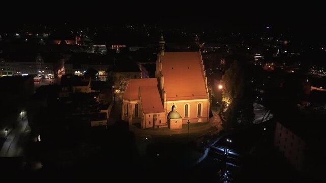 Aerial St Nicholas Cathedral Bydgoszcz Poland night 2 4K . Annual Christmas market and celebration. Historic population center northern Poland. River Brda. Modern and old architecture.