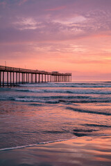 Pier Silhouette with Tiny Ocean Expanse and Negative Space at Sunset – ideal for coastal banners
