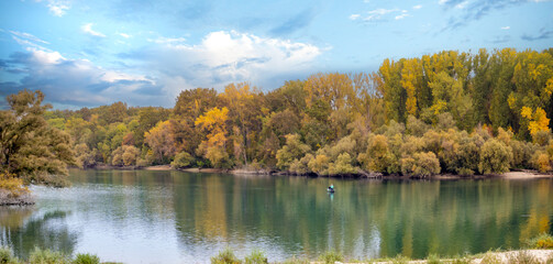Beautiful foliage along the shoires of the Rhiine (Rhein)  river viewed from cruise ship balcony