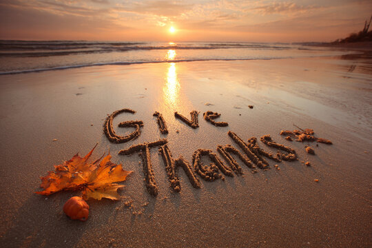 Elegant “Give Thanks” Script Drawn in Sand, Serene Shore and Open Negative Space – great for mindfulness campaigns - Powered by Adobe