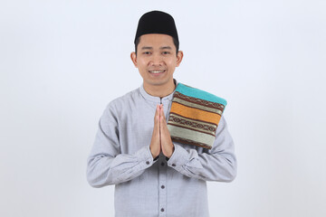 Smiling Asian Muslim Man Greeting for Eid Mubarak Ramadan