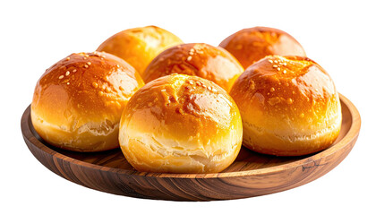 Glazed rolls in wooden bowl, golden brown