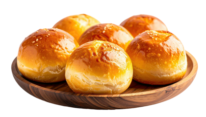 Glazed rolls in wooden bowl, golden brown