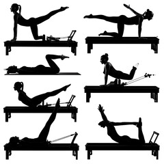 Dark silhouette woman doing yoga poses on a mat