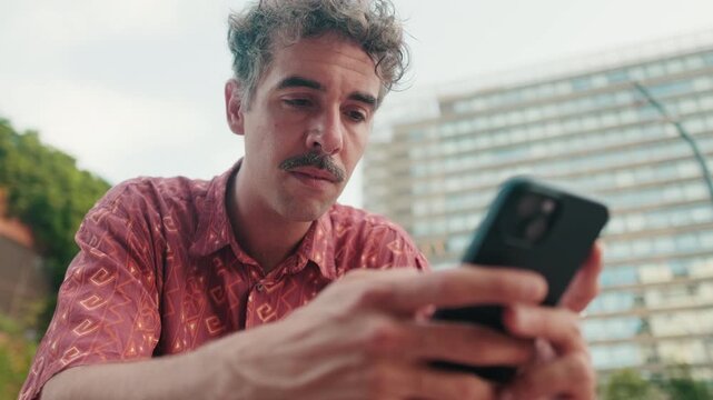 Man Using Phone in City Setting - Powered by Adobe
