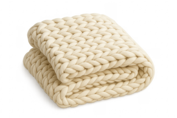 Cream chunky knit blanket providing warmth and comfort