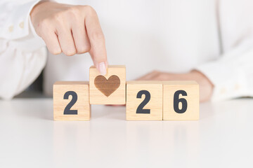 Happy New Year 2026 with heart block for health care, love, organ donation, resolution, charity, happy family, wellbeing and insurance concepts