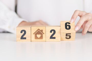 2025 end year to Happy New Year 2026 with Home and Heart block. Property investment, House Mortgage, Real Estate tax, homeless, donation, Financial and happy family concepts