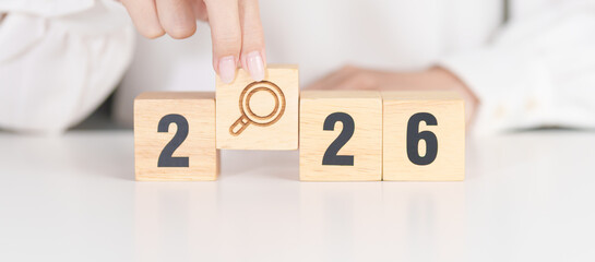 2026 year block with magnifying glass icon. SEO, Search Engine Optimization, hiring , Advertising, Idea, Strategy, marketing, Keyword, Content and New Year start concepts