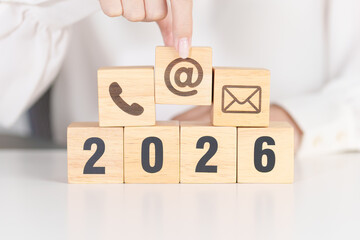 Happy New Year 2026 block for Contact Us concepts. Wood block of Email, call Phone and Website...