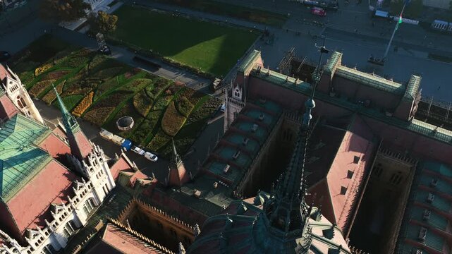 A close aerial of the Parliament&rsquo;s gothic rooflines and patterned gardens showcasing Budapest&rsquo;s intricate architectural beauty.