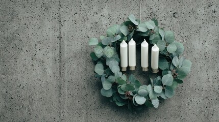 Minimalist Candle Wreath Decorated with Eucalyptus on Concrete Surface