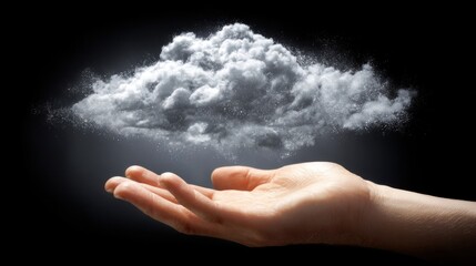 A hand holding a cloud against a black background.