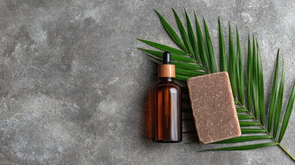 Natural Skincare Products with Amber Dropper Bottle and Soap on Green Palm Leaf