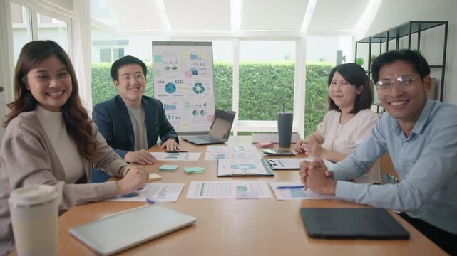 Diverse Group young adult Gen Z asia people work happy smile laugh look at POV camera screen at table desk office workplace board room video call. Success male female asian white collar labor ESG day.