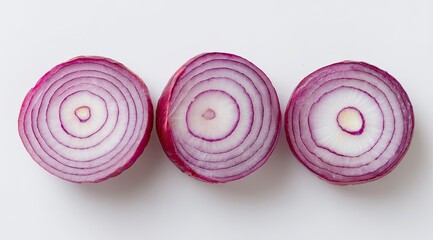 Three sliced red onions, showing layers
