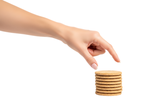 Woman's hand reaches for stack of round biscuits isolated on black . Isolated on transparent background, png