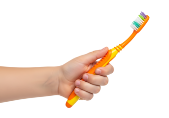 Hand holding bright orange toothbrush ready for daily oral hygiene routine . Isolated on transparent background, png