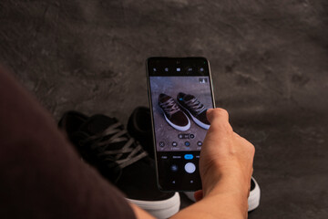 man taking photo to a product with his cellphone