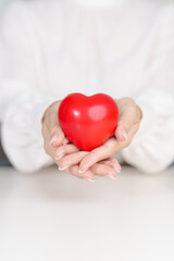 woman hand holding red heart shape. love, donor, September world heart day, world health day, CSR...