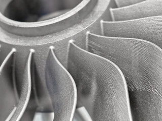 Metal products crafted through additive manufacturing showcasing intricate design and precision in 3D printing technology © nordroden
