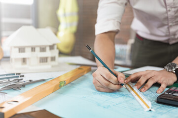 architect, engineer, engineering, Architect or engineer drawing on a blueprint with precision tools at the office desk, symbolizing creativity, planning, and professional architectural design work.