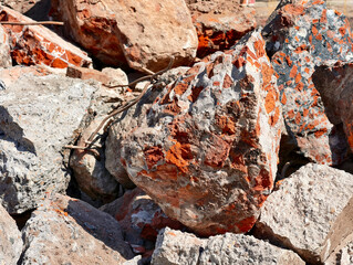 Colorful debris from a demolished structure in an urban construction site during daylight