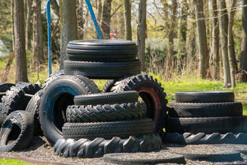 Tire tower on a play ground, built for children to climb on and play, but also recycle old tires 