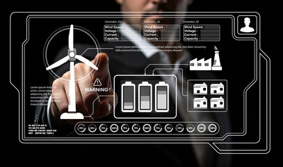 Business person interacting with futuristic interface showing wind energy data analytics and warning signal with wind turbine and battery icons