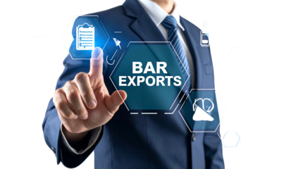 Business person in suit interacting with holographic interface for bar exports