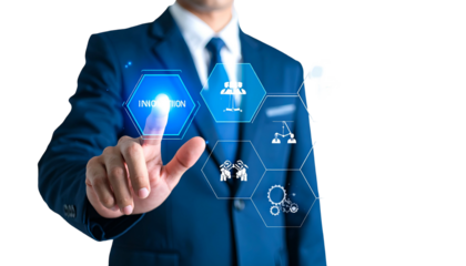 Businessman in suit points to digital innovation hexagon interface with icons