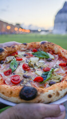 Sunset pizza dining spot at Piazza dei Miracoli overlooking the Tower