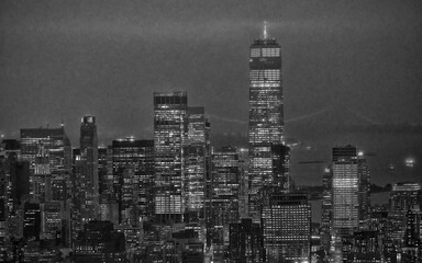 Naklejka premium Bird’s-eye nighttime panorama of NYC Manhattan highlighting city lights and urban layout