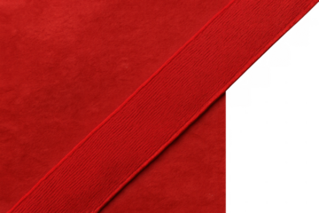 Red fabric background with diagonal wide ribbon creating abstract frame, gift wrapping with transparent space