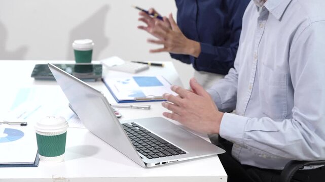 Group Asian professionals in business casual attire engaged in modern education,combining edutainment with skill upskilling,blockchain innovation,decentralized finance learning in office environment.