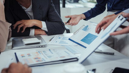 Group Asian professionals in business casual attire engaged in modern education,combining...