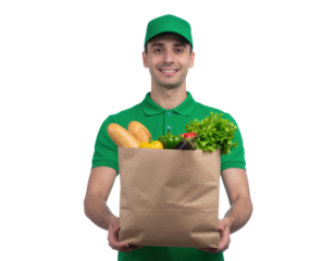 A smiling delivery man holds a brown paper bag filled with fresh groceries, including vegetables and bread.