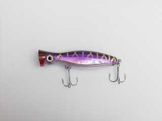 Metal fishing lure on white background