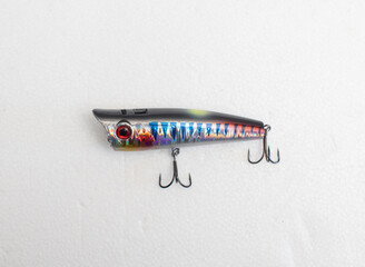 Metal fishing lure on white background
