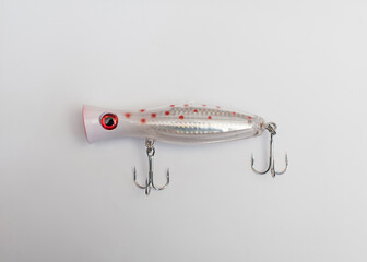 Metal fishing lure on white background