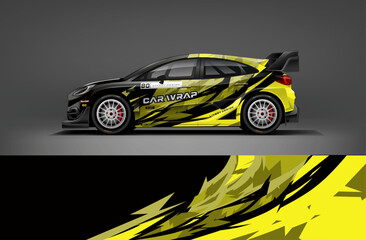 Black rally car wrap with yellow and gray jagged streaks for an aggressive and high-energy racing concept. Editable vector EPS format included.